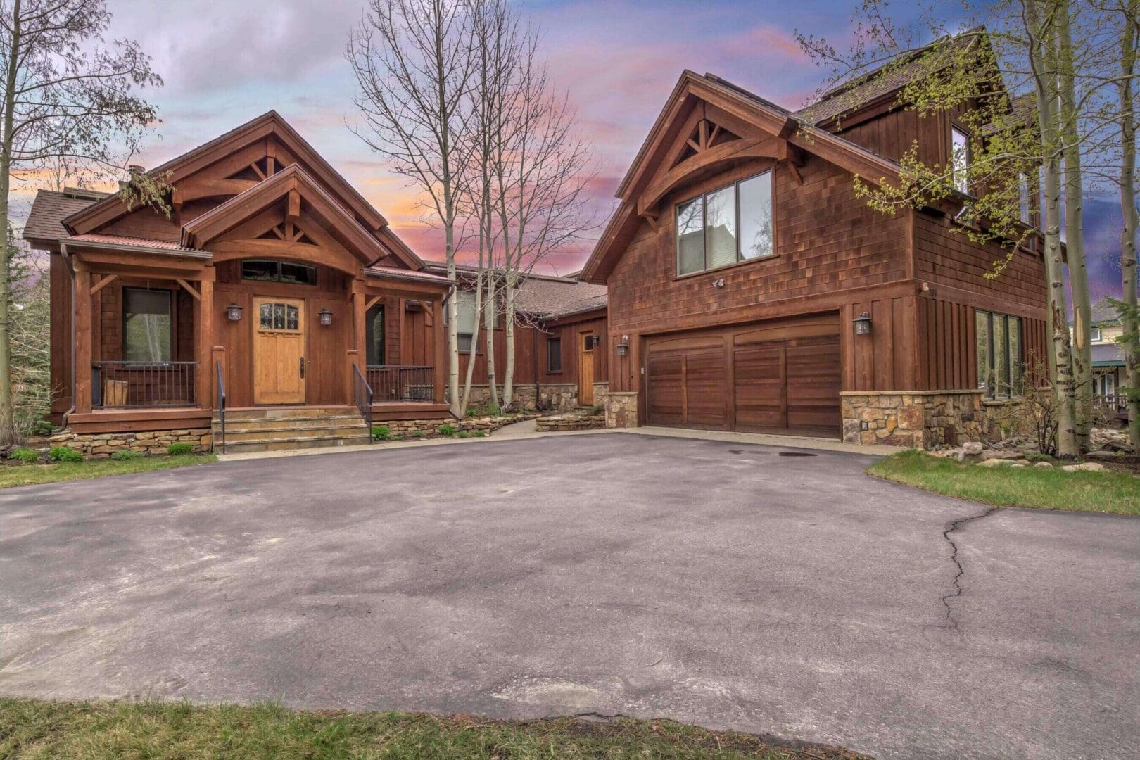 Rustic wooden house with garage at sunset