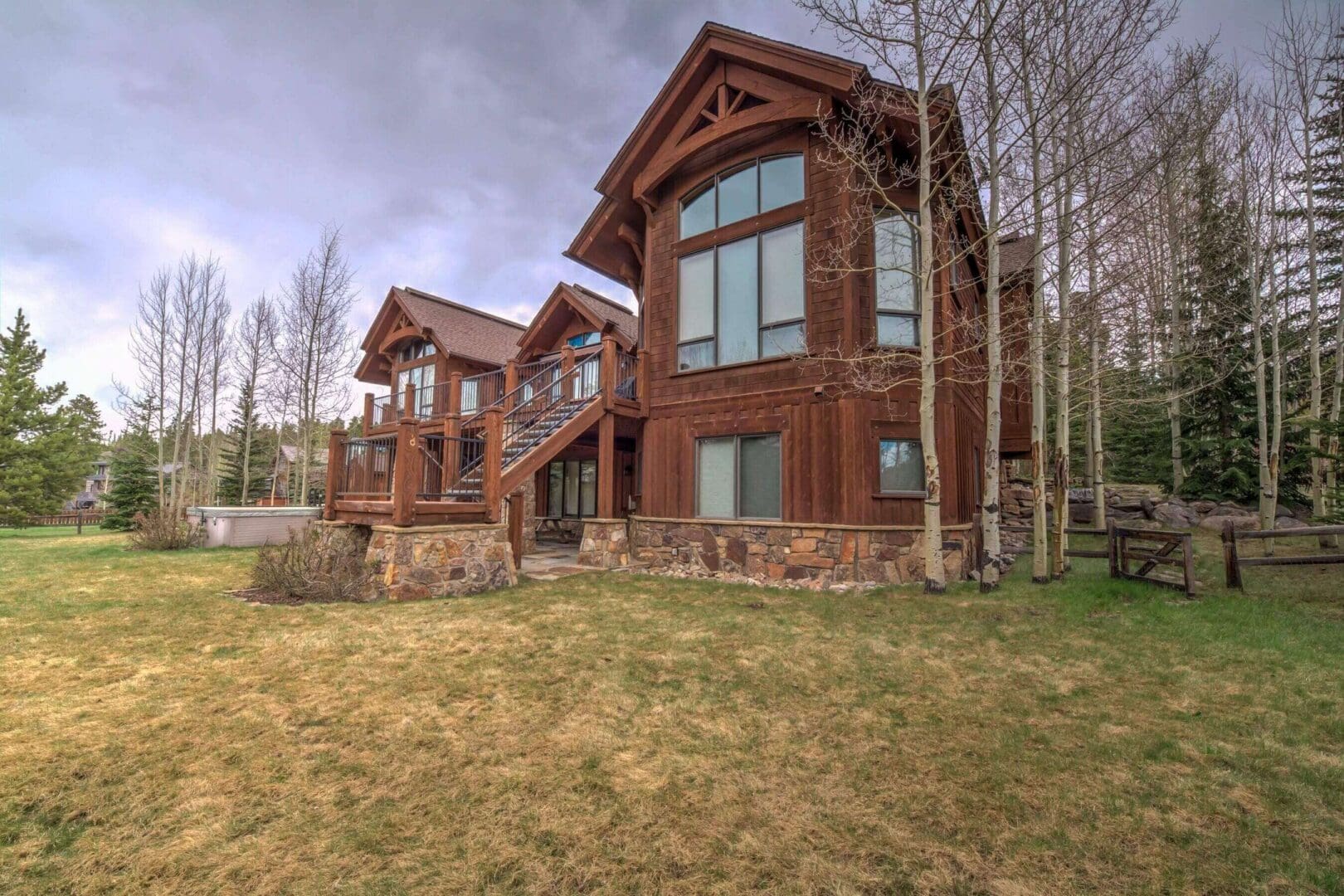 Large wooden cabin with stone foundation